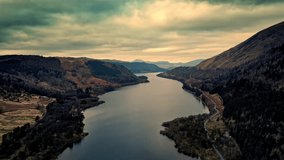 Experience the stunning beauty of Cumbria through a mesmerizing aerial video, capturing Thirlmere Lake encircled by grand mountains.