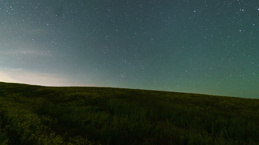 Time lapse of Milky Way galaxy over wildflower superbloom at Carrizo Plain in Southern California, USA