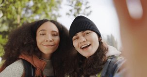 Friends, talking and streaming outdoor in nature on adventure, travel and hiking or camping. Face of happy influencer women together for video call or experience on holiday or vacation in woods