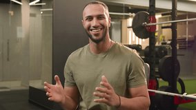 African American man sportsman athlete guy fitness trainer in gym sport club talking at camera talk speak video call blog vlog after workout healthy lifestyle exercise tutorial male blogger speaking - Powered by Shutterstock - Get 15% off with code: PIKWIZARD15