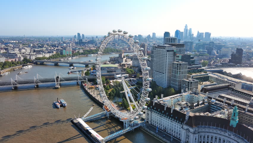 Aerial View of London, UK: Iconic Ferris Wheel the London Eye in Center of Capital City of Great Britain and Northern Ireland Royalty-Free Stock Footage #1106341271