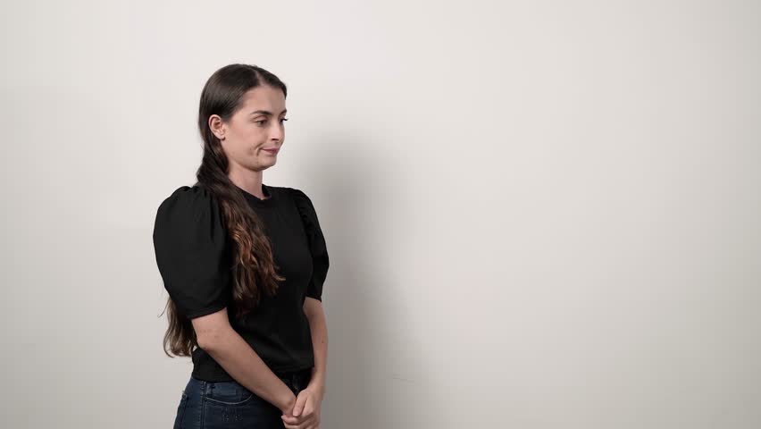 Woman in black shirt scolding her son for something he did, woman upset with another person for the damage done, desperate business manager with her workers on a white background Royalty-Free Stock Footage #1106342397