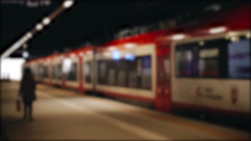 Blurred background video. The electric train leaves from the platform of the main station