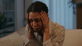 Sorrowful upset African American woman stressed girl suffer headache grief sorrow depression crying lady at night evening home close face with hands worried mental problem breakup unwanted pregnancy - Powered by Shutterstock - Get 15% off with code: PIKWIZARD15