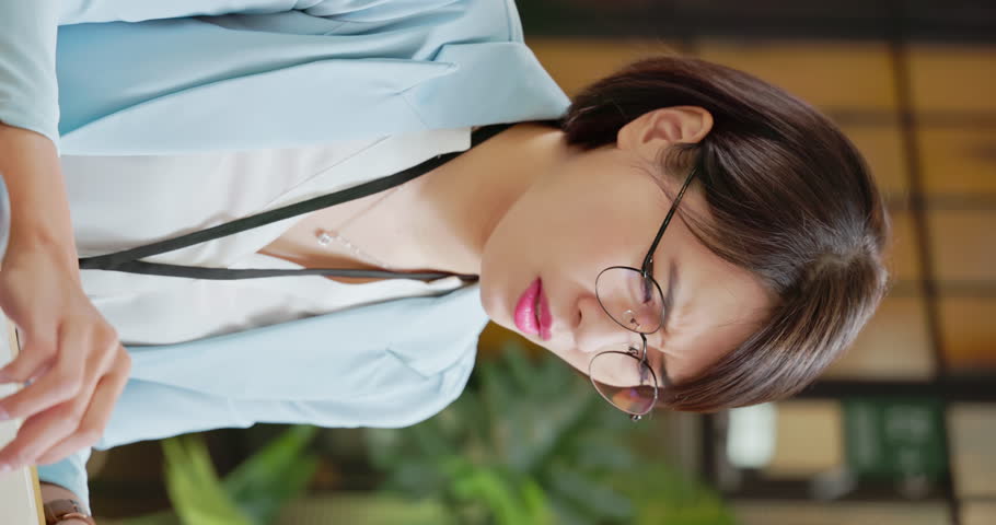 pain at work - vertical sick asian business woman suffer from flu and sneezing with tissue in office Royalty-Free Stock Footage #1106349549