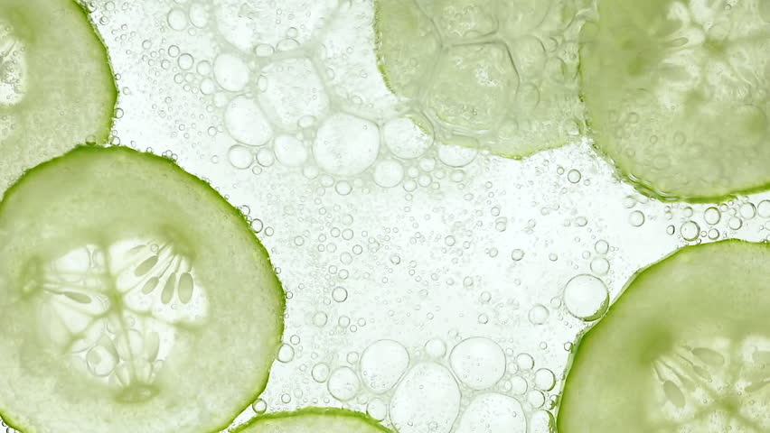 cucumbers in mineral water float on the surface of the water, use in medicine, cosmetology and spa Royalty-Free Stock Footage #1106356061