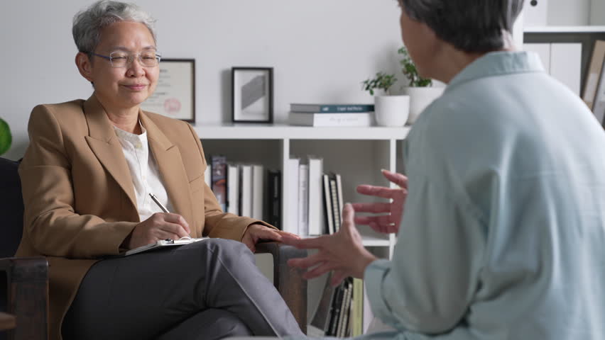 Therapist, psychologist talking and counselling to Asian patient at office during psychology treatment. Royalty-Free Stock Footage #1106358603