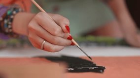 Beautiful Asian female artist working on abstract painting,  painter creating modern art