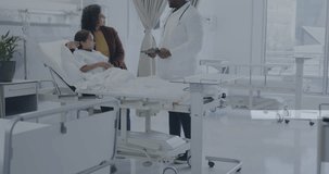 Animation of medical data processing over african american male doctor with girl patient. Global healthcare, science, medicine, research and data processing concept digitally generated video.