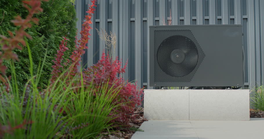 The heat pump for heating the pool is mounted on site. Ornamental plants nearby. Energy Saving Technologies. 4k video Royalty-Free Stock Footage #1106361357
