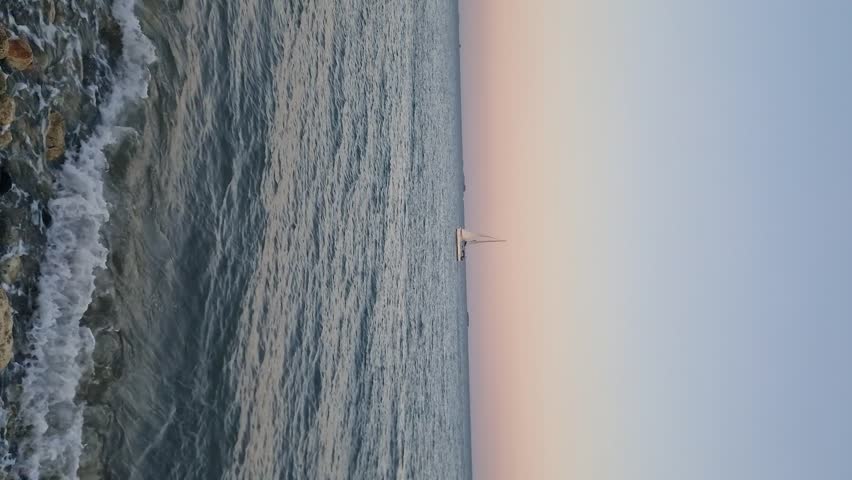 Yacht in the tropical sea at sunset. 
