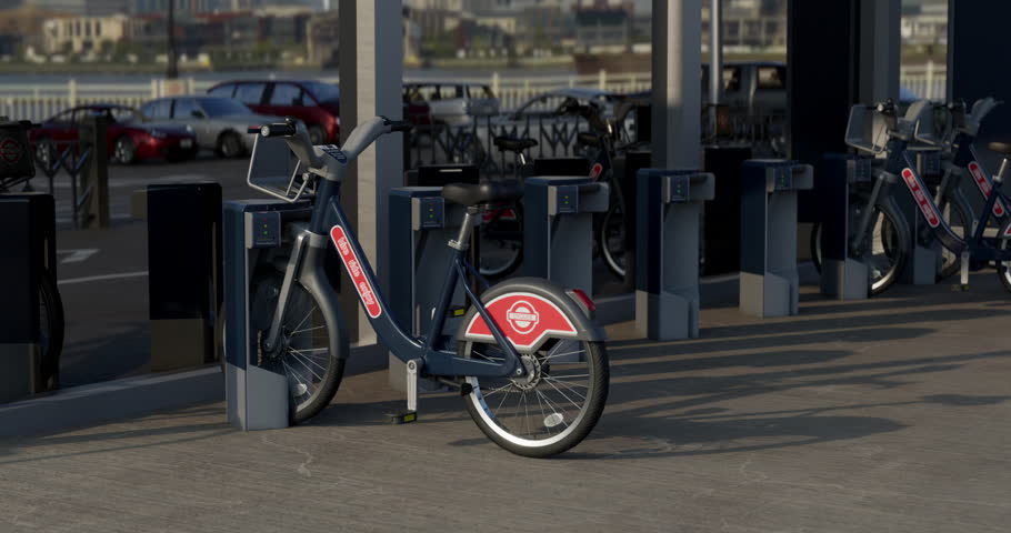 Row of Green bicycles for rent. Electric bicycle charging station. Shared electric bikes parked on city street