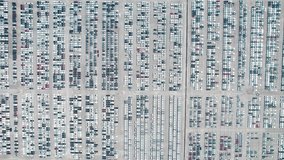 Aerial view of Cargo port full of cars. Cars and containers ready to be transported further