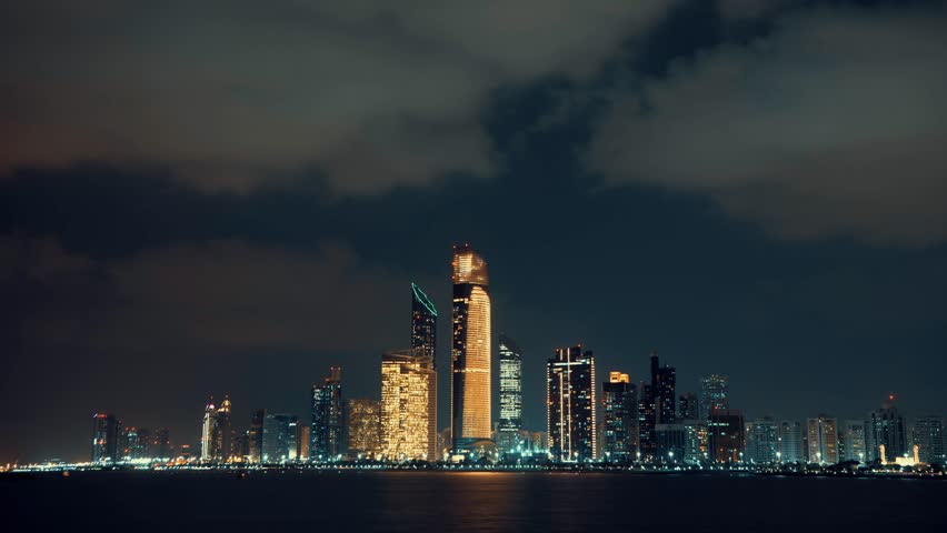 Abu Dhabi at night. Time lapse video. Moving clouds.  Royalty-Free Stock Footage #1106398013