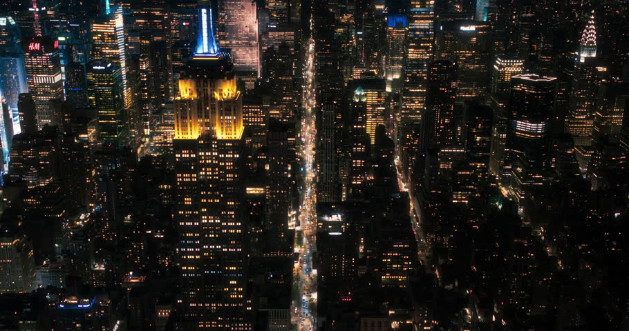 Scenic Aerial New York City View of Downtown Manhattan Architecture. High Angle Night Footage of the Business District from a Helicopter. Cityscape with Office Buildings and Busy Traffic on Streets Royalty-Free Stock Footage #1106400459