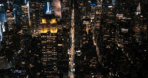 Scenic Aerial New York City View of Downtown Manhattan Architecture. High Angle Night Footage of the Business District from a Helicopter. Cityscape with Office Buildings and Busy Traffic on Streets