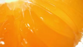 Macro video with a probe lens, the orange flesh comes alive, revealing intricate textures and vibrant hues, evoking a sense of juiciness and freshness. Fruit concept. Orange background. 4K HDR
 - Powered by Shutterstock - Get 15% off with code: PIKWIZARD15