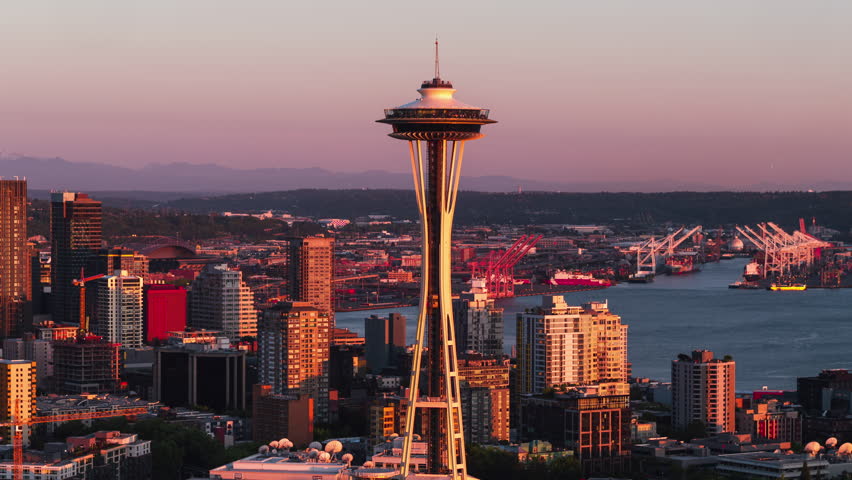 Timelapse, Hyperlapse, Super Shot, Establishing Aerial View Shot of Seattle WA, Washington US, Yellow and Red, incredible light, Space Needle and Downtown Seattle Skyline, Mount Rainier