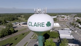 Clare, Michigan water tower with drone video moving in a circle.