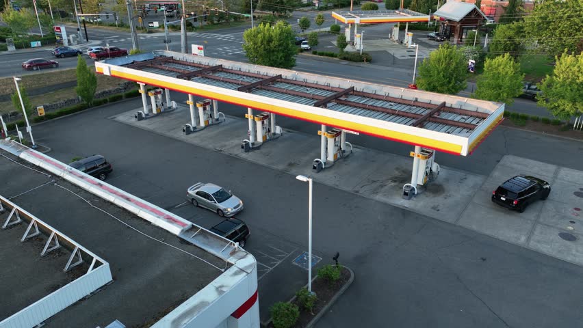 Aerial view of Americans filling up their cars at the local gas station.