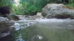 Camera on water surface of agitated river, Rio Jima in Dominican Republic. Low angle 