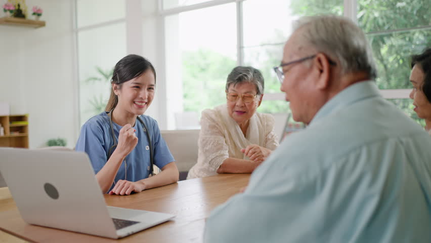 Group of asian senior people listening to young nurse.Psychological support group for elderly therapy session in a community centre. Group therapy in session sitting in a circle in a nursing home. Royalty-Free Stock Footage #1106414175