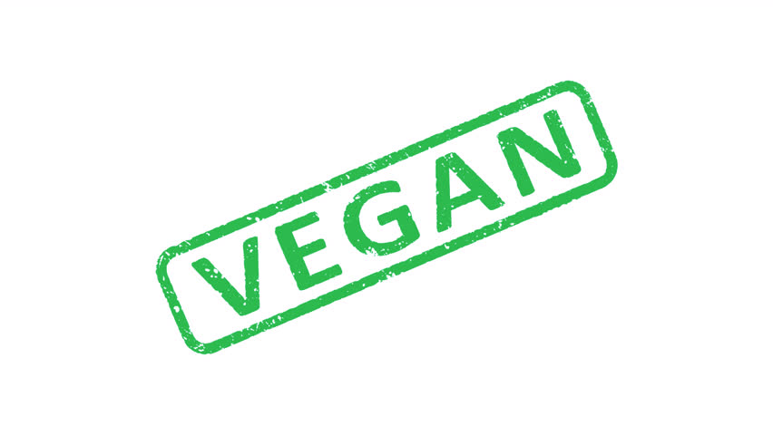 Vegan rubber stamp animation over transparent background.  The Word VEGAN being stamped.  Ecology, organic, vegetarian and natural healthy food concepts. Alpha Channel Included.