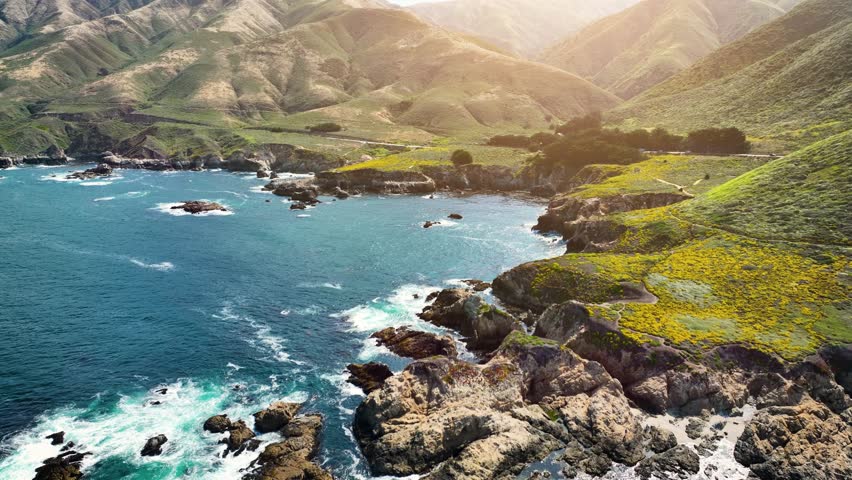 Aerial shot of the Pacific Coast Highway and rugged coastline in Central California