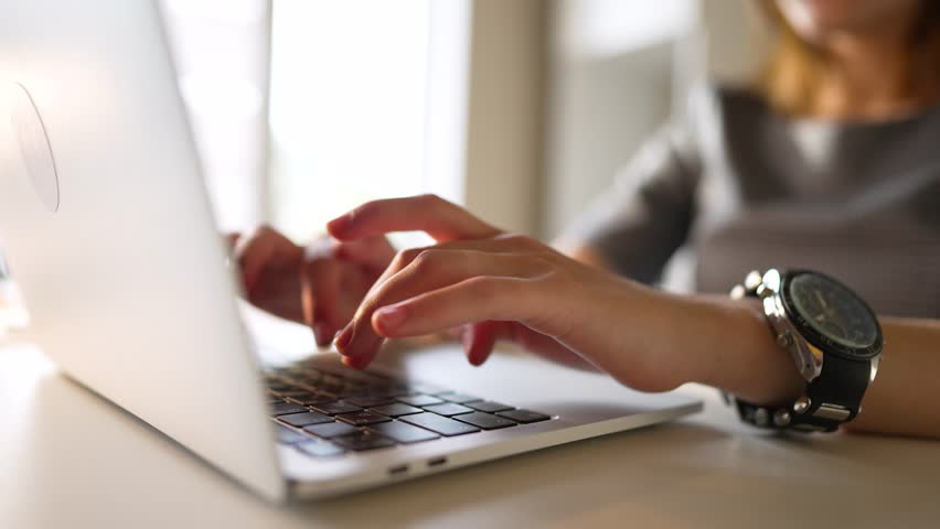 Woman working at home office hand on keyboard close up.Girl at table with laptop.Hands on keyboard.Blogger online webinar.Girl prints letter on keyboard.Young woman work on computer at table in office Royalty-Free Stock Footage #1106429711