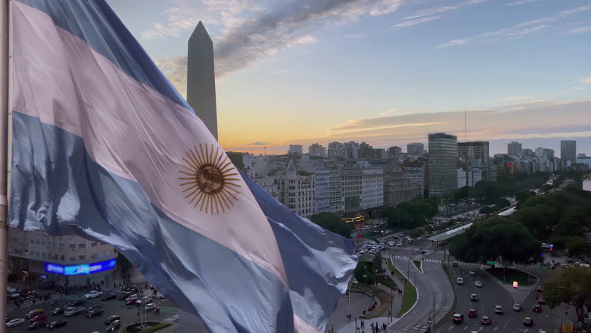 Flag of Argentina Over Buenos Aires City at Sunset. Royalty-Free Stock Footage #1106434337