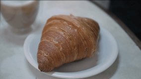 close up to a plate of fresh french croissant bakery with selective focusing for breakfast or afternoon tea light snack meal