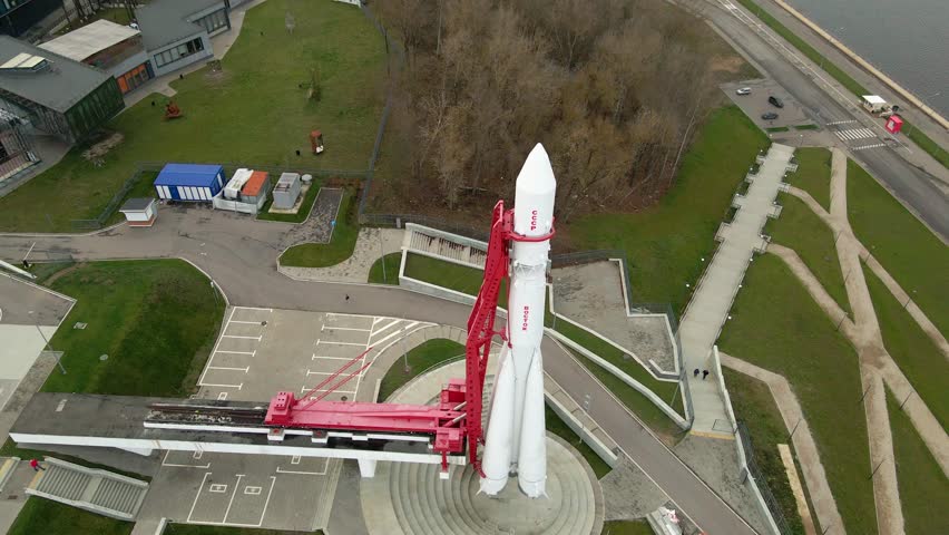 POV an aerial view of an outdoor exhibit. The museum displays models of Sputnik-1 type spacecraft and samples of lunar dust, a rocket park, in particular, the R-7