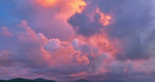 
aerial view The purple clouds obscured the bright orange clouds that drifted slowly.
Clouds Forming in stunning sunrise.
The sky was dark, and in the distance, the clouds began to spin together, 