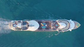Aerial view of the cruise ship in open water. Cruise liner sailing the ocean or sea on a sunny summer day. Aerial top view of luxury large cruise ship. journey concept. Miami. Vertical video. 