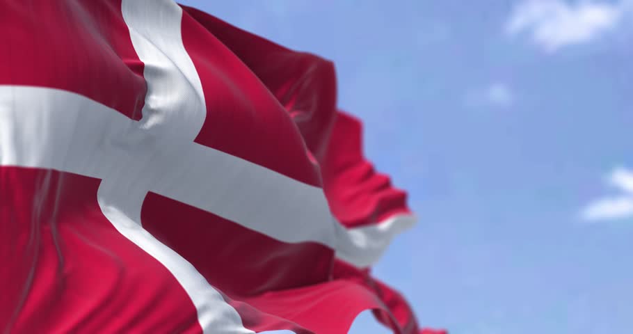 Denmark national flag waving in the wind on a clear day. Fluttering fabric. Seamless 3d render animation. Slow motion loop. Selective focus. Fluttering fabric. 4k
