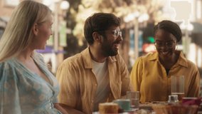 Two Diverse Couples Spending Time Together on a Double Date, Enjoying Delicious Food at an Outdoors Pizzeria. Multiethnic Young Men and Women Having Joyful Conversations, Smile and Laugh at Jokes - Powered by Shutterstock - Get 15% off with code: PIKWIZARD15