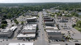 Downtown Cadillac, Michigan with drone video moving down in close up.