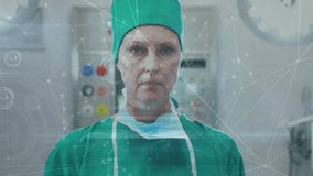 Animation of data processing over caucasian female surgeon in face mask. Global healthcare, science, medicine, research, computing and data processing concept digitally generated video.