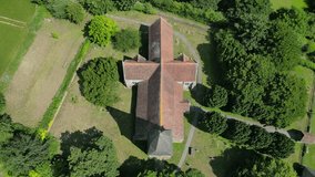 A top-down pull-out shot of St John the Evangelist church in Ickham village, Kent.