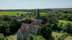 An aerial push-in shot towards Ickham village and the St John the Evangelist church.
