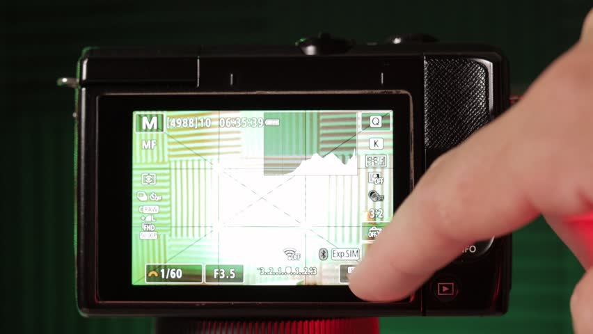 Adjustment of ISO done in mirrorless camera, close up view.