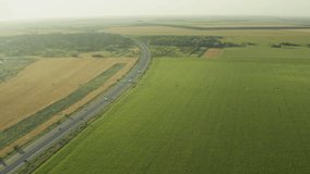 A2 highway in Romania. 4K aerial video with motorway road from Bucharest to Constanta during a beautiful summer sunrise. High speed infrastructure industry.