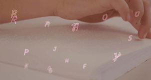 Animation of letters and numbers over caucasian schoolchild reading braille. Disability, school, learning and education concept digitally generated video.