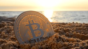 Bitcoin BTS coin in sand near sea waves on sandy beach of sea coast at dawn sunset close-up. Concept cryptocurrency money cryptography cryptocurrencies bitcoins crypto-currencies. Peer-to-peer payment - Powered by Shutterstock - Get 15% off with code: PIKWIZARD15