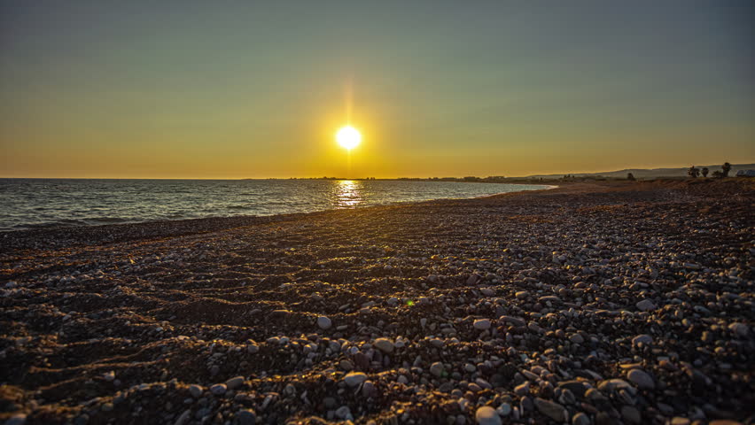 Pebble Shore Of Paphos Beach During Sunset In Southwest Cyprus. Timelapse