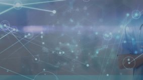 Animation of connected dots and people icons over caucasian male doctor using digital tablet. Digital composite, social media, telecommuting, portrait, medical, healthcare and technology concept. - Powered by Shutterstock - Get 15% off with code: PIKWIZARD15