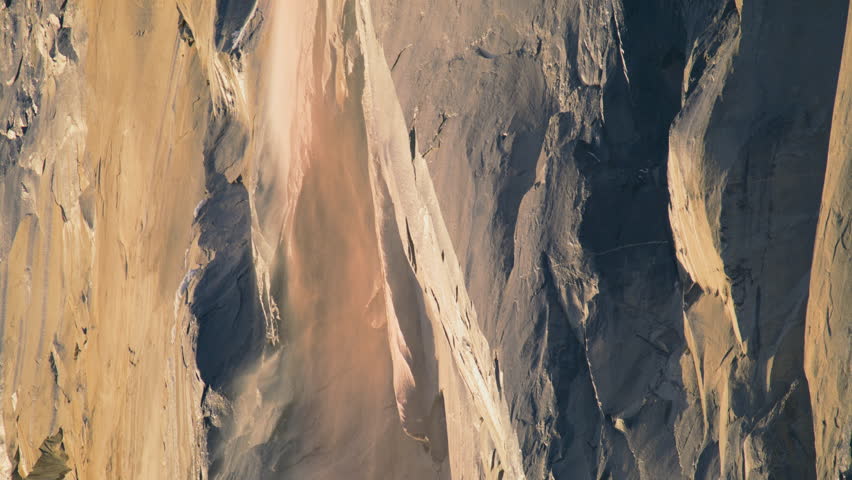 Closeup view of Yosemite Firefall located in Yosemite National Park, California, USA. Breathtaking shot of Horsetail fall in Yosemite valley, Sierra Nevada mountain range, 4k footage with copy space