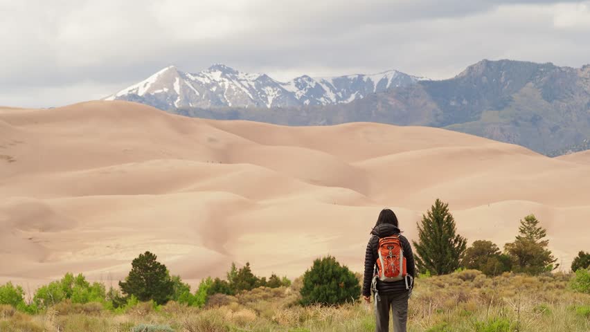 Woman hiking in Great Sand Dunes National Park and Preserve at Colorado