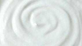 White Greek yoghurt or sour cream texture circle rotation close up top view - Powered by Shutterstock - Get 15% off with code: PIKWIZARD15