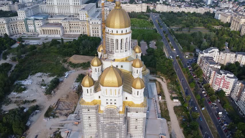 4K Drone flyover footage of the under construction Catedrala Mantuirii Neamului in Bucharest. People